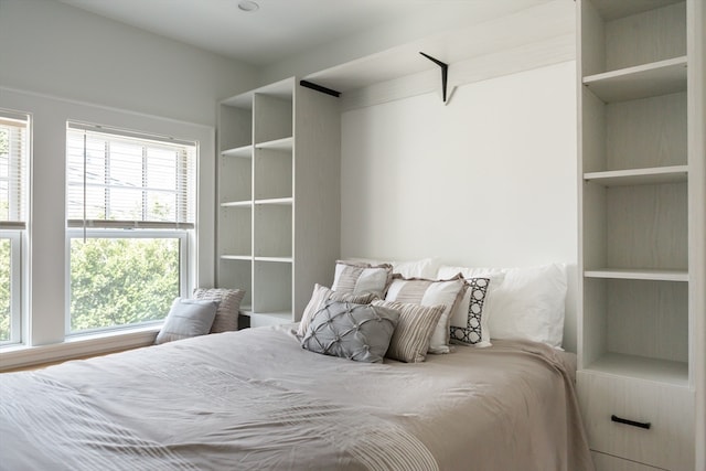 bedroom with multiple windows