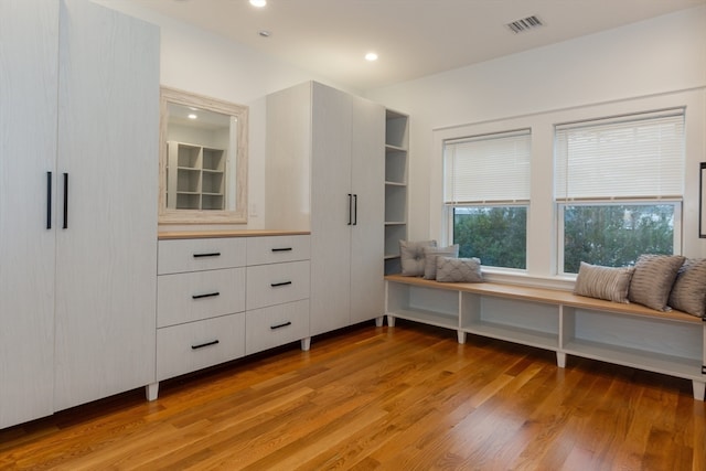 interior space featuring white cabinets and light hardwood / wood-style flooring