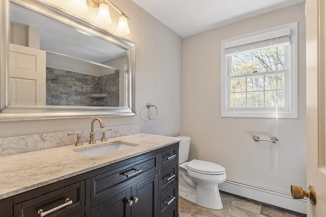full bath featuring vanity, a shower, baseboard heating, and toilet