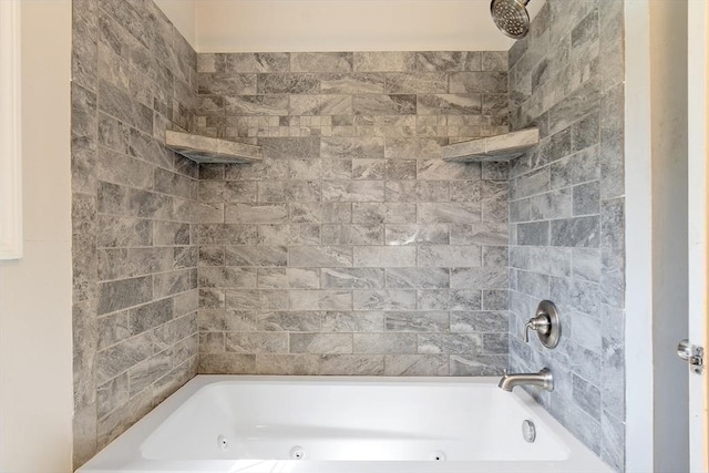 bathroom with a combined bath / shower with jetted tub
