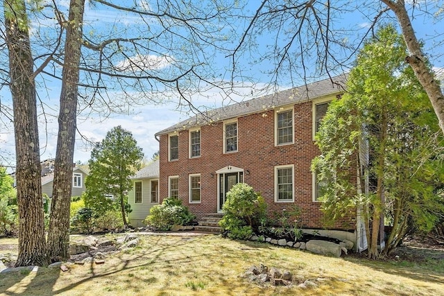 colonial house with brick siding