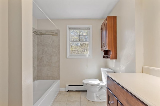bathroom featuring tile patterned flooring, vanity, toilet, baseboards, and a baseboard radiator