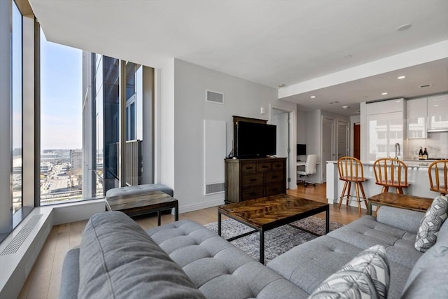 133 Seaport Blvd Unit 1710, Boston, MA 02210 - living area with recessed lighting, light wood-style flooring, and visible vents