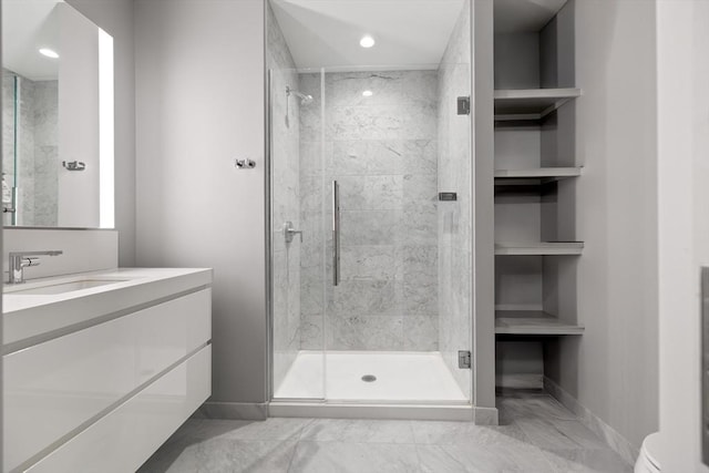 133 Seaport Blvd Unit 1710, Boston, MA 02210 - bathroom featuring toilet, a shower stall, marble finish floor, and vanity