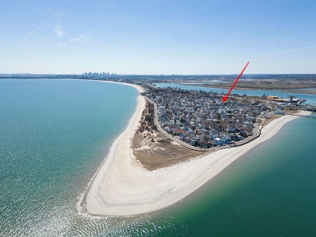 bird's eye view featuring a beach view and a water view