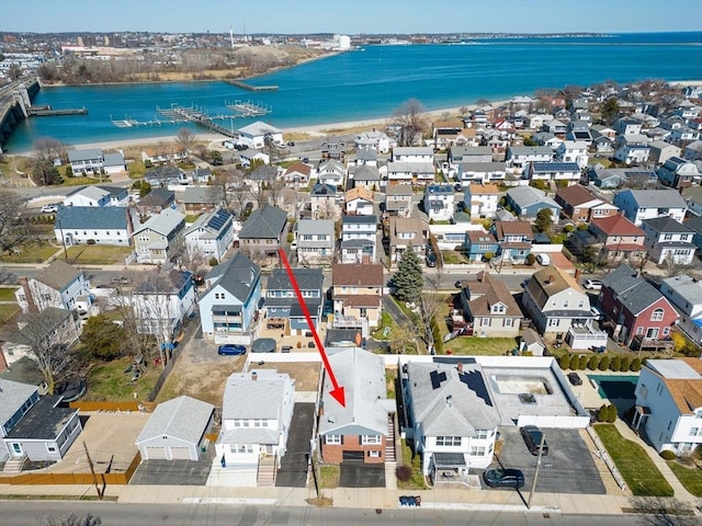 birds eye view of property featuring a water view and a residential view