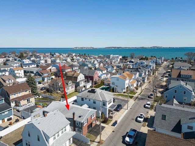 birds eye view of property featuring a water view and a residential view