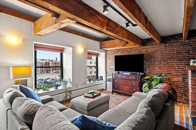 living room with a baseboard radiator, brick wall, beam ceiling, and rail lighting