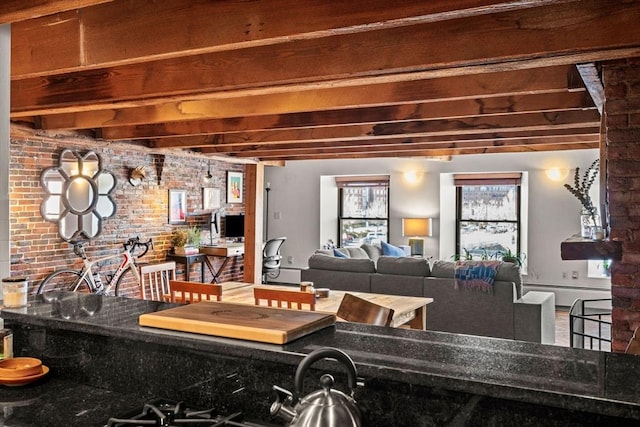 bar featuring beamed ceiling, brick wall, and baseboard heating