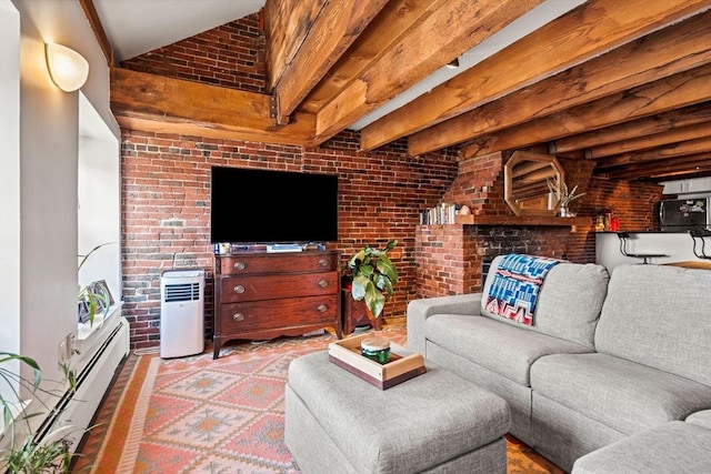 living room featuring beamed ceiling, a baseboard radiator, and brick wall