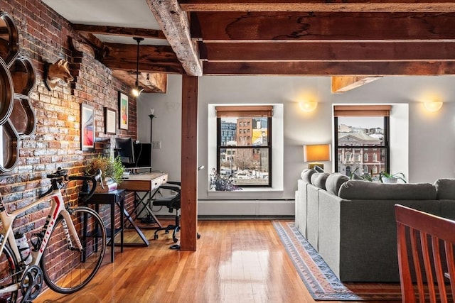 interior space with wood-type flooring, brick wall, and beam ceiling