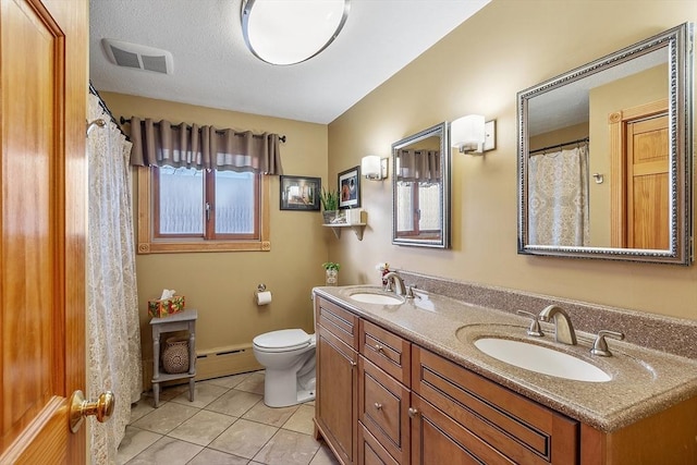 bathroom with a baseboard radiator, vanity, toilet, tile patterned floors, and a textured ceiling