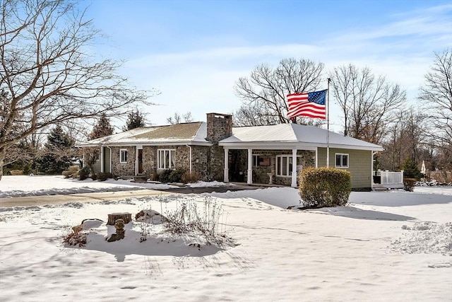 snow covered house with cooling unit