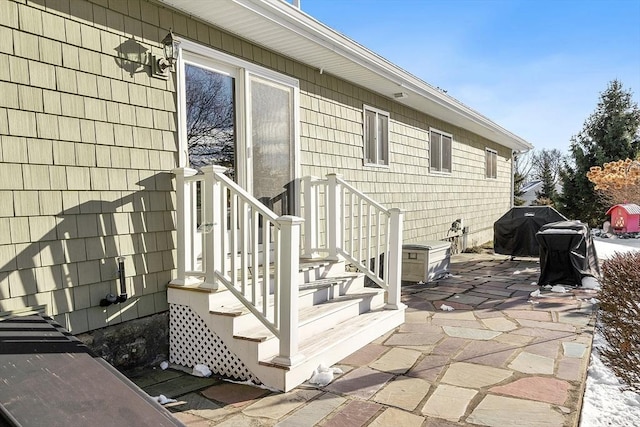 property entrance featuring a patio