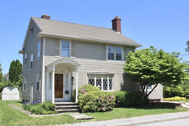 25 Rollinson Rd, Worcester, MA 01606 - view of front of property featuring a chimney and a front lawn