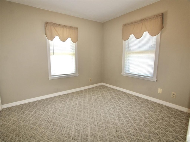 25 Rollinson Rd, Worcester, MA 01606 - spare room with plenty of natural light, carpet, and baseboards