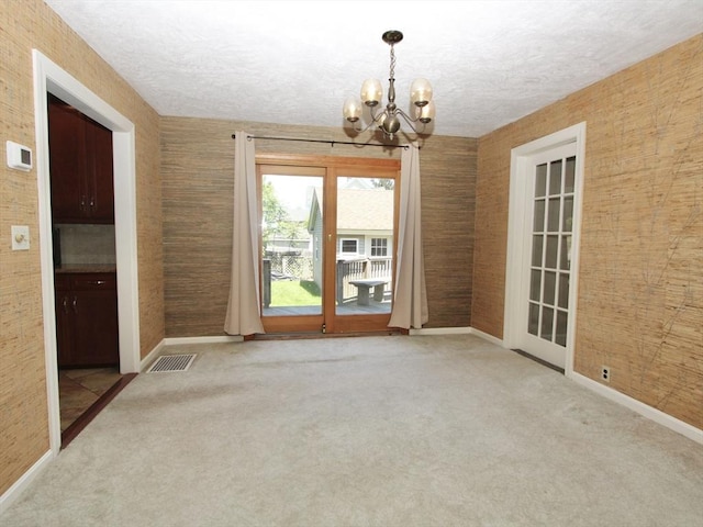 25 Rollinson Rd, Worcester, MA 01606 - unfurnished dining area with a chandelier, carpet floors, baseboards, and a textured ceiling