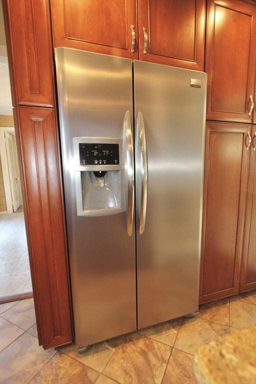 25 Rollinson Rd, Worcester, MA 01606 - kitchen view of stainless steel fridge and brown cabinets