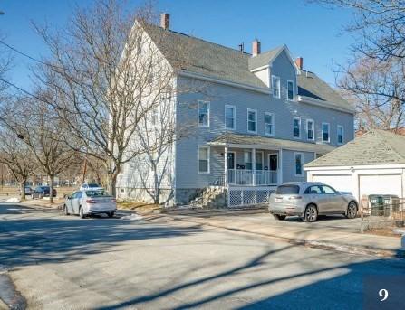 view of front of house featuring covered porch, concrete driveway, and a garage