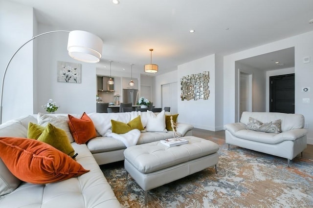 living room with baseboards and recessed lighting