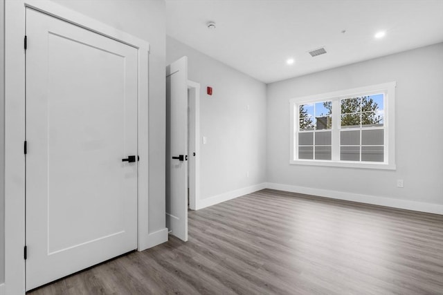 unfurnished bedroom with light wood-type flooring