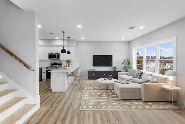 living room featuring light wood-type flooring