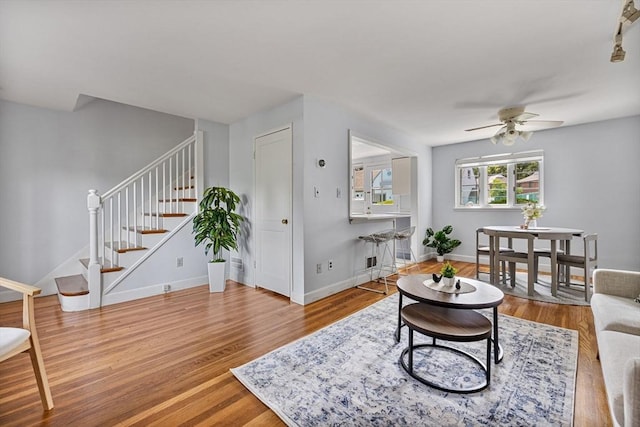 358 Lexington St Unit 358, Watertown, MA 02472 - living room with a ceiling fan, stairs, and wood finished floors