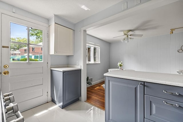 358 Lexington St Unit 358, Watertown, MA 02472 - laundry room featuring a ceiling fan and baseboards