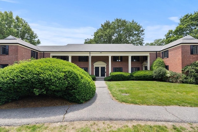 358 Lexington St Unit 358, Watertown, MA 02472 - neoclassical home featuring a front yard and brick siding
