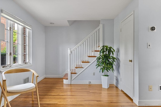 358 Lexington St Unit 358, Watertown, MA 02472 - entrance foyer featuring light wood-style flooring and stairway