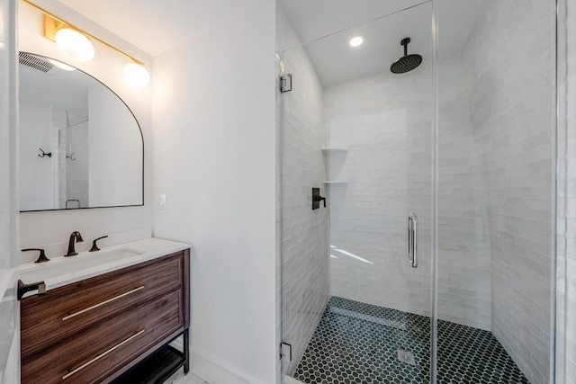 full bath featuring visible vents, a shower stall, and vanity