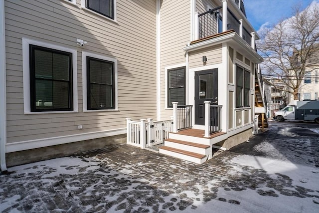 entrance to property with a balcony