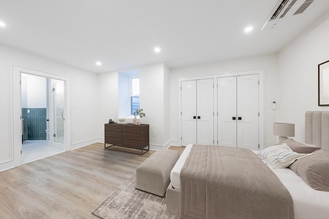 bedroom featuring connected bathroom, recessed lighting, wood finished floors, visible vents, and baseboards