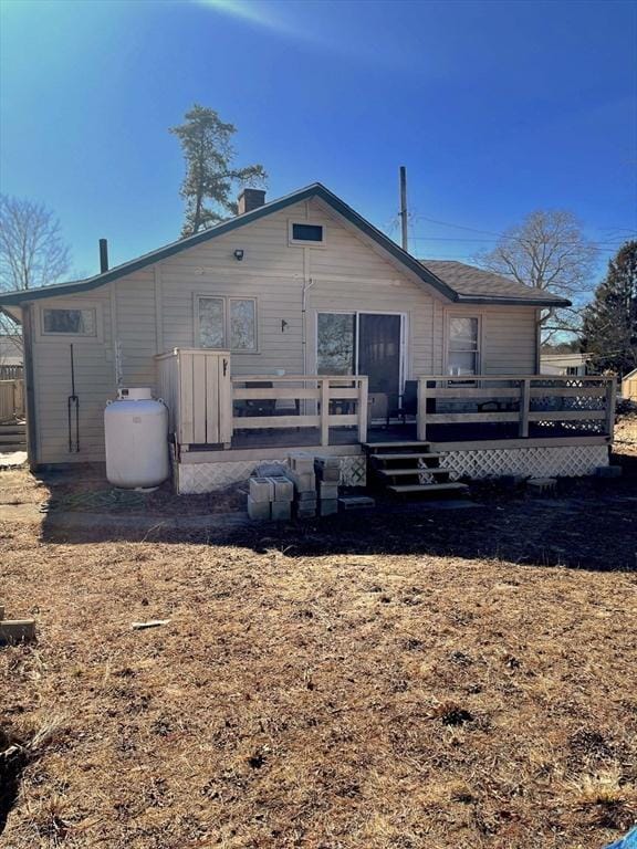 back of property featuring a deck