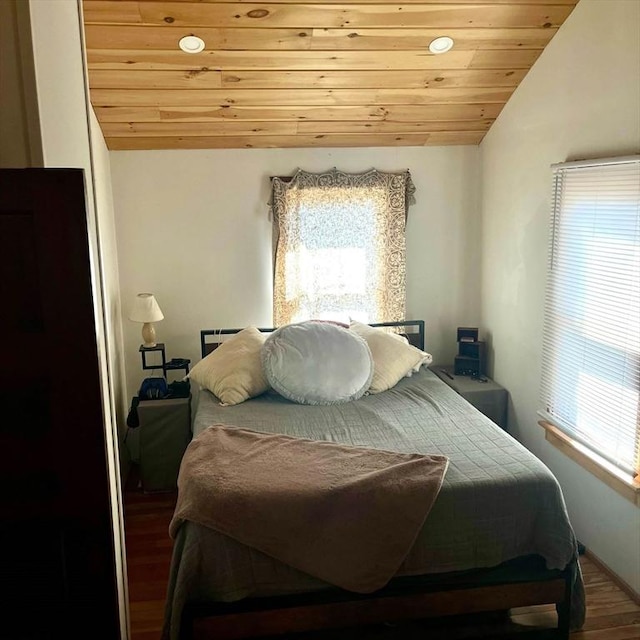 bedroom with wooden ceiling, wood finished floors, and vaulted ceiling