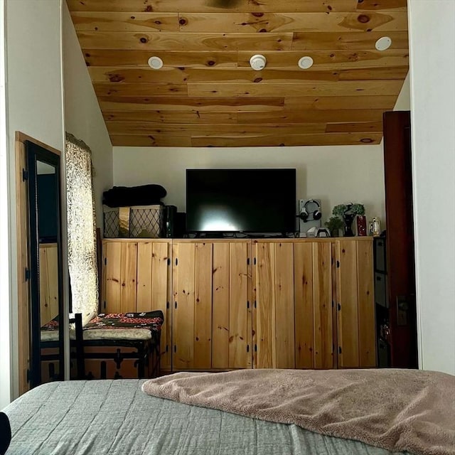 bedroom featuring lofted ceiling and wood ceiling