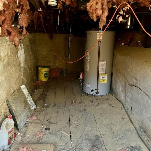 utility room with crawl space and water heater