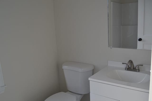 bathroom with toilet and vanity