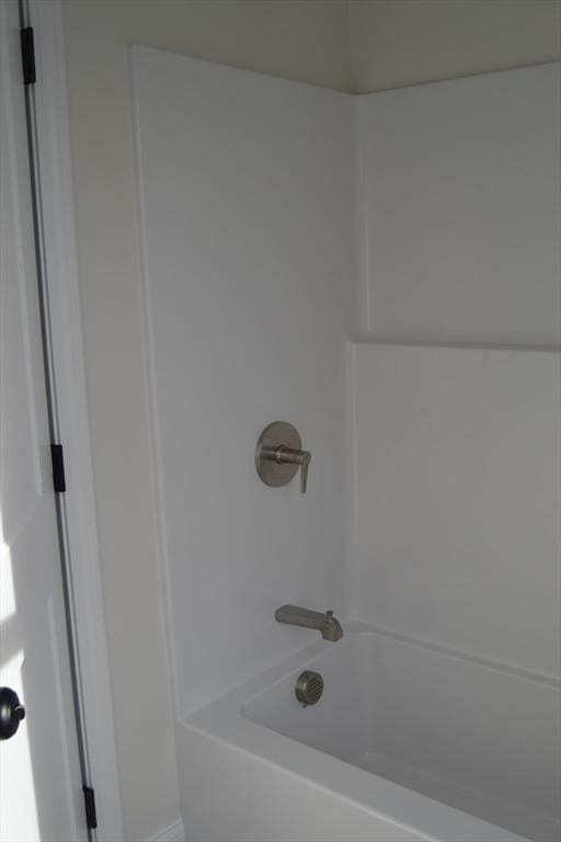 bathroom featuring washtub / shower combination