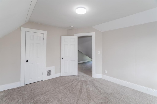 33-35 Claremont St, Springfield, MA 01108 - unfurnished bedroom with vaulted ceiling, carpet, and baseboards