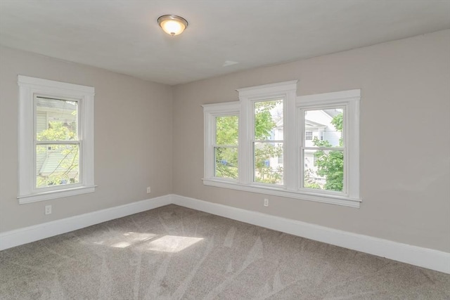 33-35 Claremont St, Springfield, MA 01108 - carpeted empty room featuring baseboards