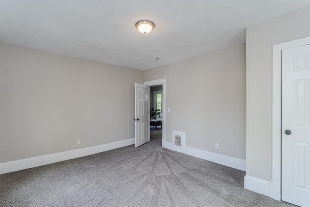 33-35 Claremont St, Springfield, MA 01108 - empty room with carpet floors and baseboards