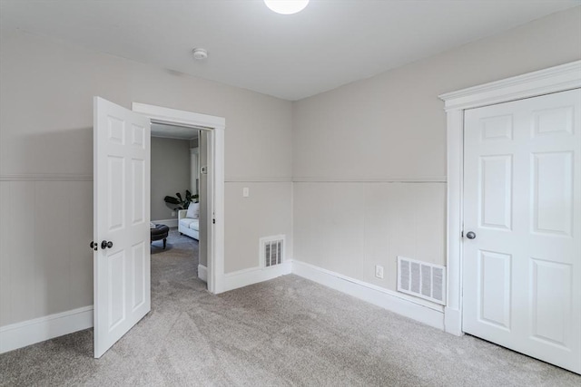 33-35 Claremont St, Springfield, MA 01108 - unfurnished bedroom featuring carpet floors, wainscoting, and baseboards