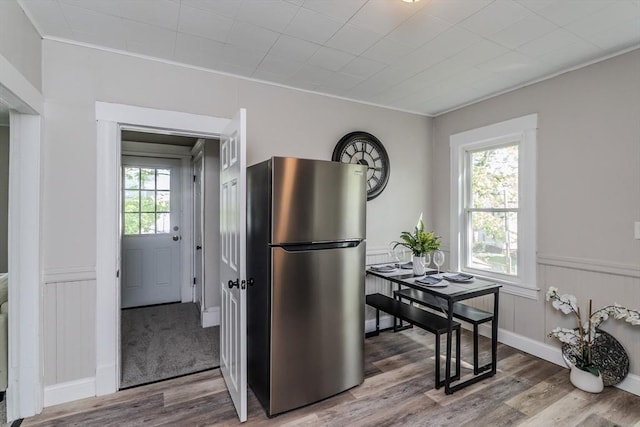 33-35 Claremont St, Springfield, MA 01108 - kitchen featuring freestanding refrigerator, wood finished floors, crown molding, and wainscoting