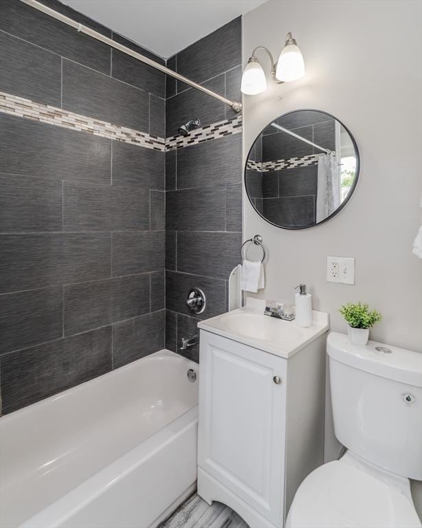 33-35 Claremont St, Springfield, MA 01108 - bathroom with toilet, shower / bath combination with curtain, and vanity