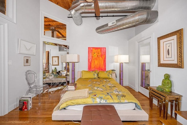 bedroom with wood-type flooring