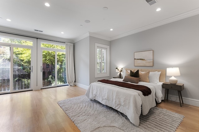 bedroom with access to exterior, light hardwood / wood-style flooring, and ornamental molding