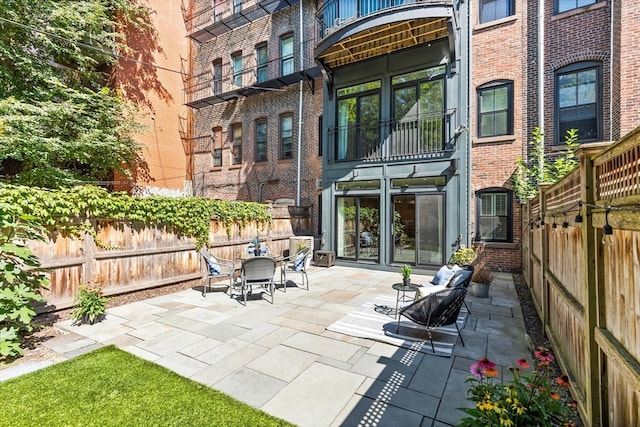 view of patio with a balcony