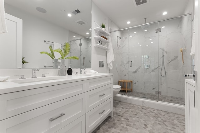 bathroom featuring walk in shower, vanity, and toilet