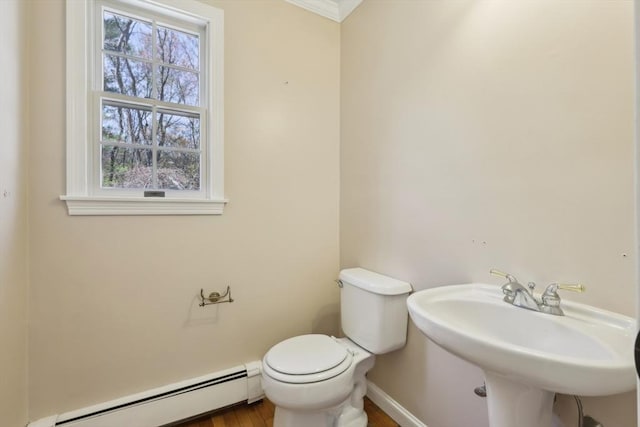 89 Brush Hill Rd, Sherborn, MA 01770 - bathroom featuring plenty of natural light, baseboards, a baseboard radiator, and toilet
